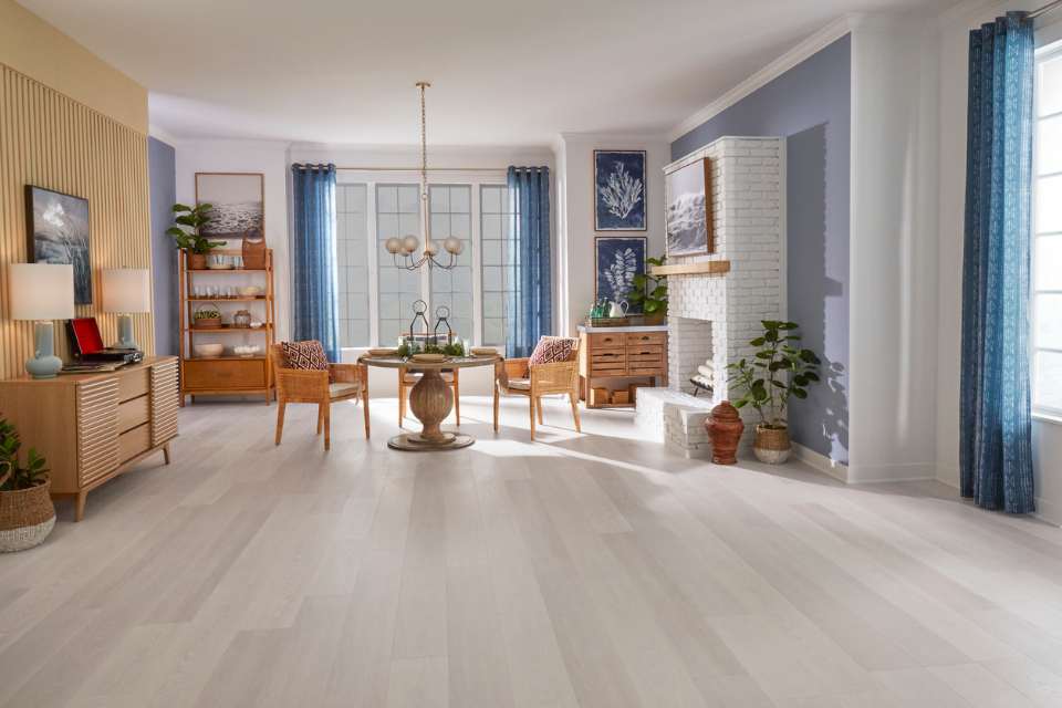 light gray oak look flooring in mid century modern living dining space